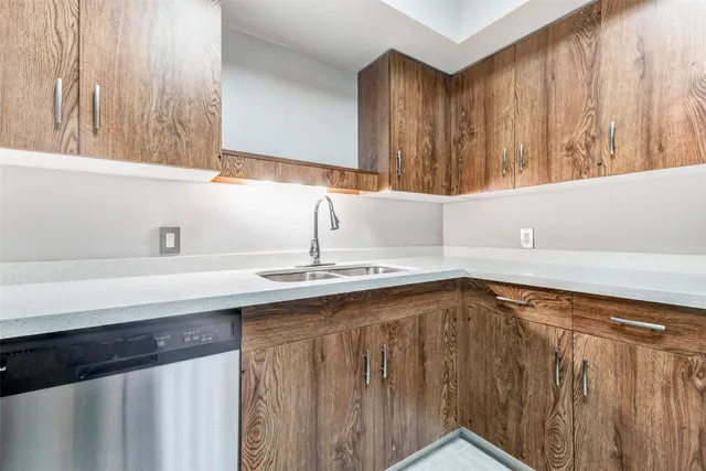 a kitchen with stainless steel appliances granite countertop a stove microwave and sink
