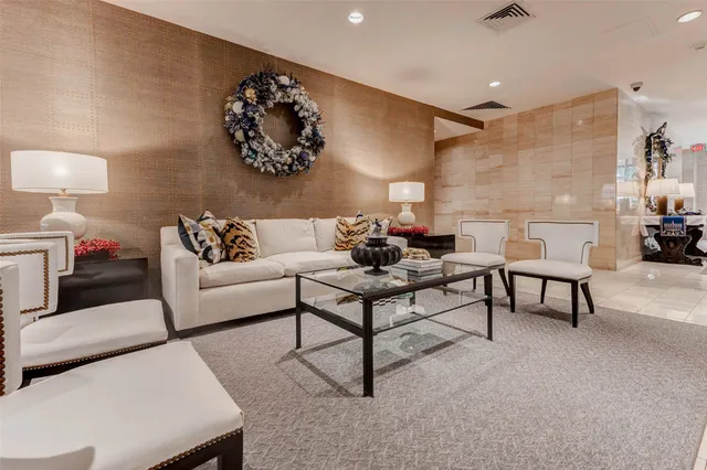 a living room with furniture and a lamp