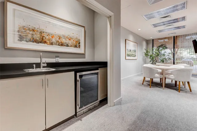 a kitchen with a sink and a refrigerator