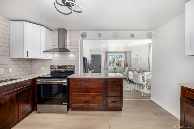 a kitchen with a stove and a sink
