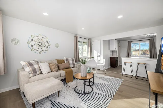 a living room with furniture and a table