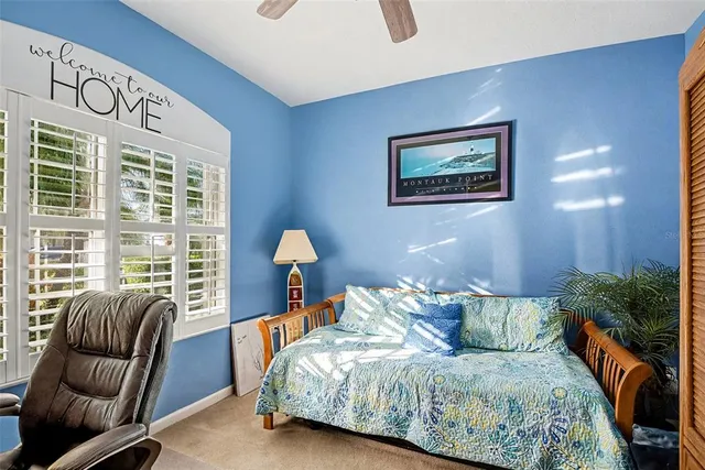 a bedroom with a bed and a couch