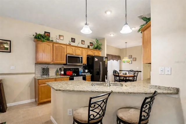 a view of a dining table and chairs