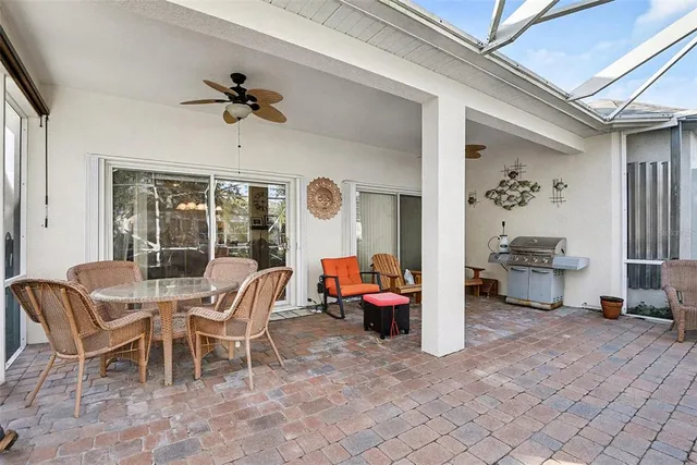a view of a house with backyard porch and sitting area