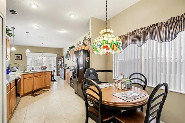 a view of a dining room and hall with furniture