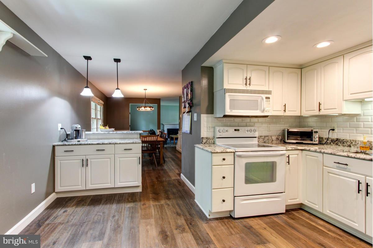 12328 Coleraine Court Reston, VA 20191 - Photo 14 of 30 Kitchen is open to the dining room