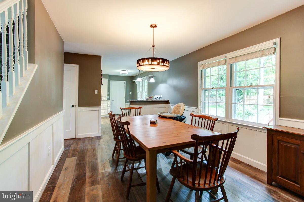 12328 Coleraine Court Reston, VA 20191 - Photo 9 of 30 Dining Room features wainscoting and large windows