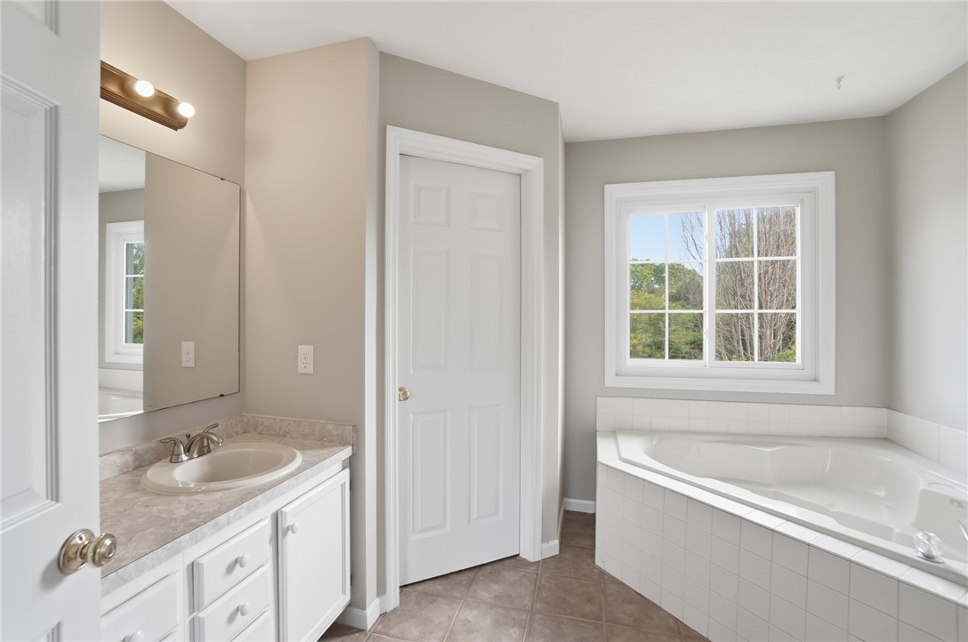 10 Chase Court Springboro, OH 45066 - Photo 36 of 75 This bathroom offers a large soaking tub and ample counter space for daily routines.