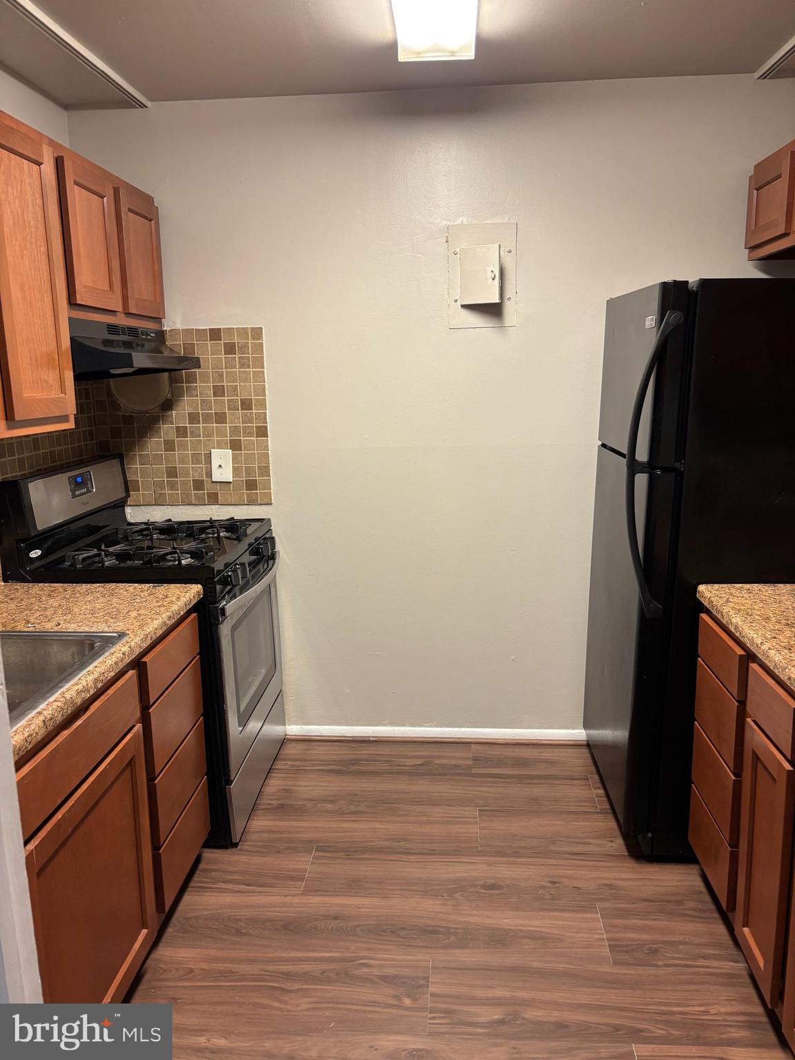 3853 St Barnabas Road, Unit 202 Suitland, MD 20746 - Photo 9 of 20 a kitchen with a refrigerator and a stove
