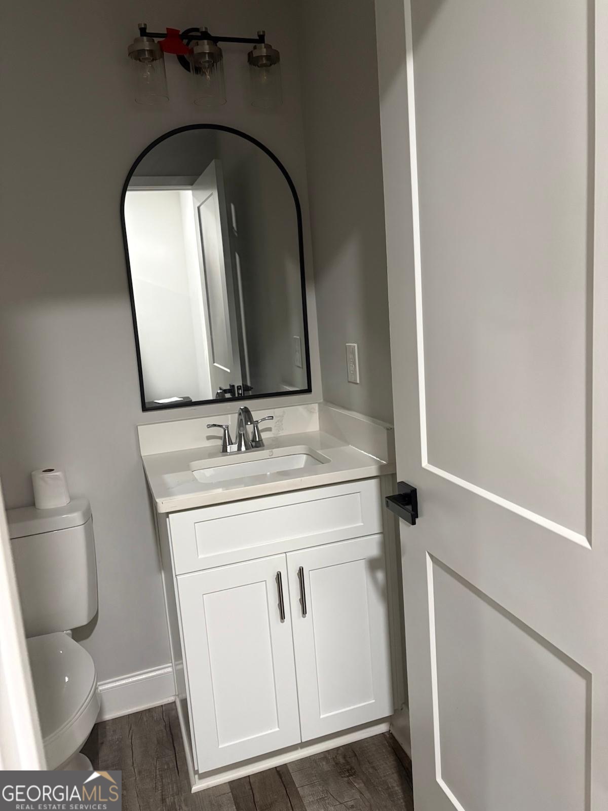 606 Old River Road Cornelia, GA 30531 - Photo 17 of 27 a bathroom with a granite countertop toilet sink and mirror
