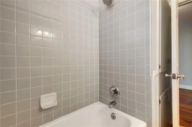 a bathroom with a sink a toilet and shower curtain