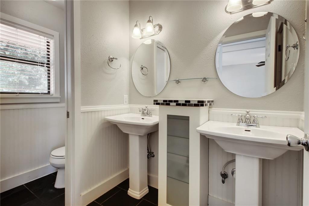 1408 Ruth Avenue Austin, TX 78757 - Photo 17 of 33 a bathroom with a sink and a mirror