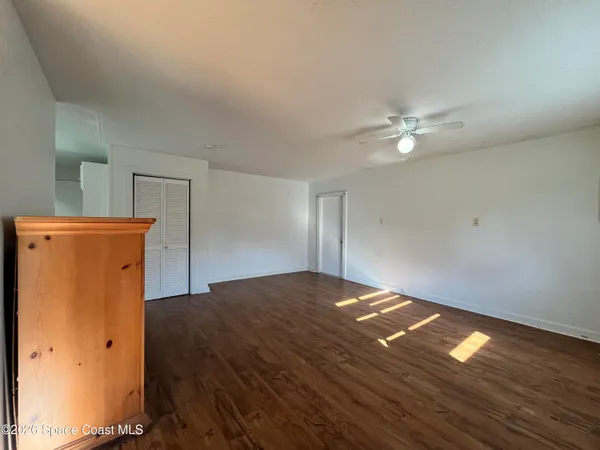 a view of a livingroom with wooden floor
