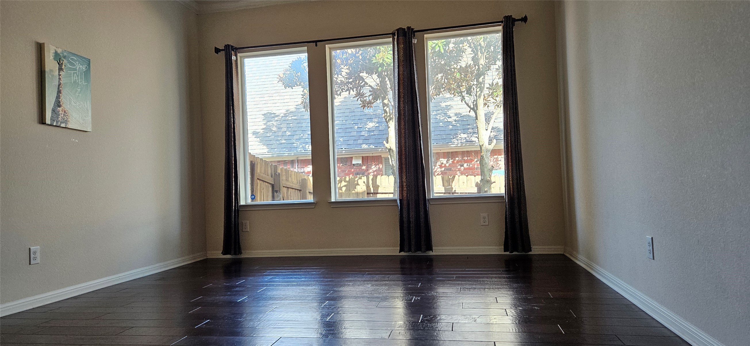 116 Azimuth Drive Austin, TX 78717 - Photo 21 of 33 a view of an empty room with wooden floor and a window