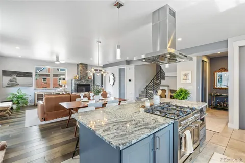 a kitchen with center island and wooden floor