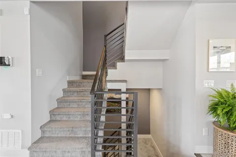 a view of staircase with white walls