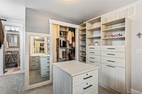 a view of a storage & utility room with dryer and washer