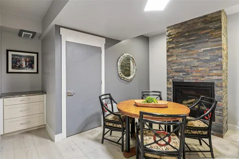 a bathroom with a granite countertop sink a toilet and shower