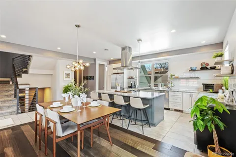 a kitchen with a table and chairs in it