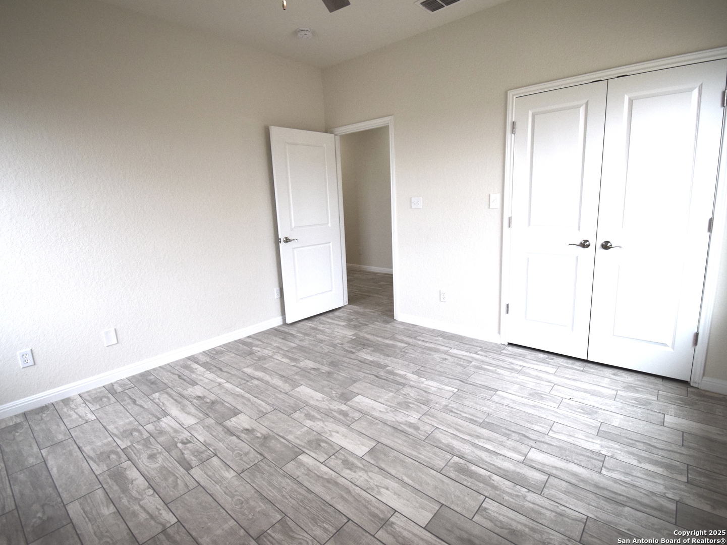 14329 Wisdom Road Atascosa, TX 78002 - Photo 12 of 18 a view of empty room with wooden floor