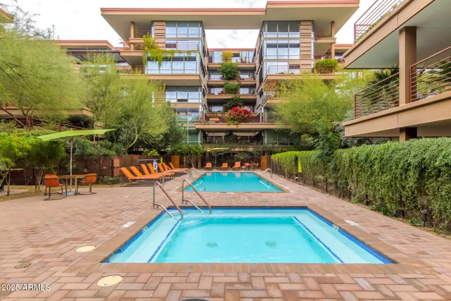 an outdoor space with lots of furniture and plants