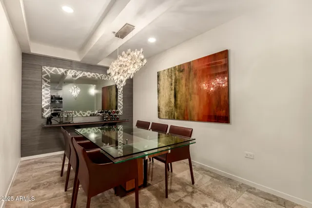 a dining room with a table and chairs