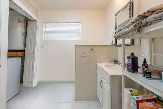 5334 Dartmouth Road New Port Richey, FL 34652 - Photo 11 of 13 a utility room with cabinets