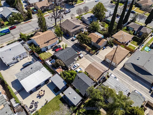 an aerial view of a house with a yard