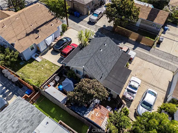 an aerial view of a house with a yard and garden