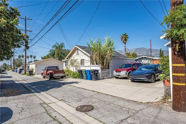 a view of a cars park in front of house