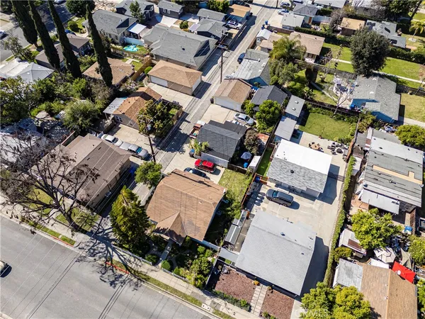 an aerial view of a residential houses with outdoor space