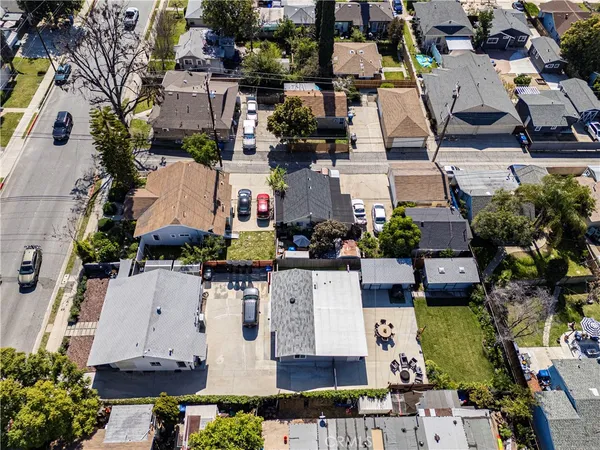 an aerial view of multiple houses with outdoor space