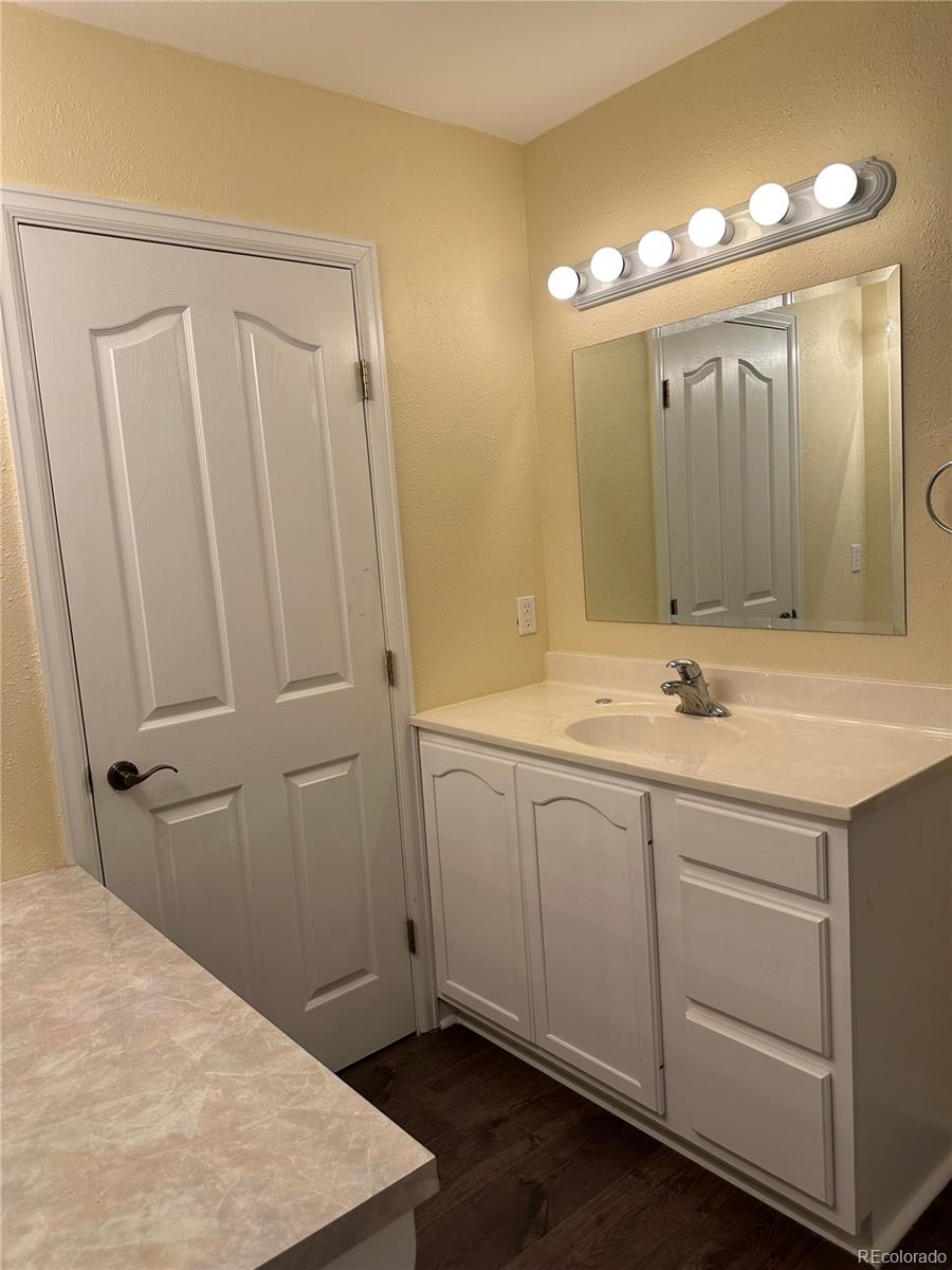 29469 County Road Fort Garland, CO 81133 - Photo 12 of 36 a bathroom with a double vanity sink and a mirror