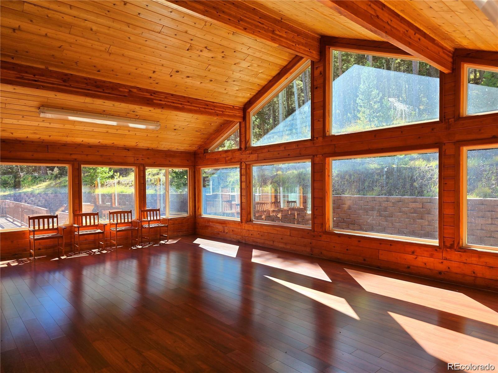 29469 County Road Fort Garland, CO 81133 - Photo 20 of 36 a view of an empty room with wooden floor and a window