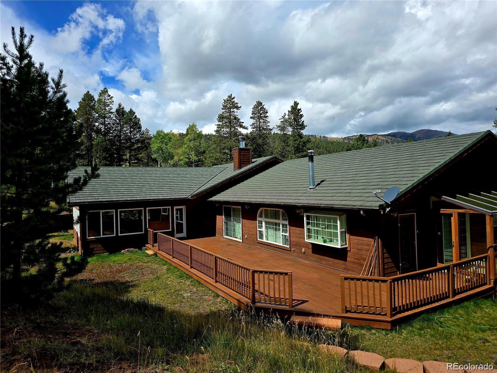 29469 County Road Fort Garland, CO 81133 - Photo 29 of 36 a front view of a house with garden