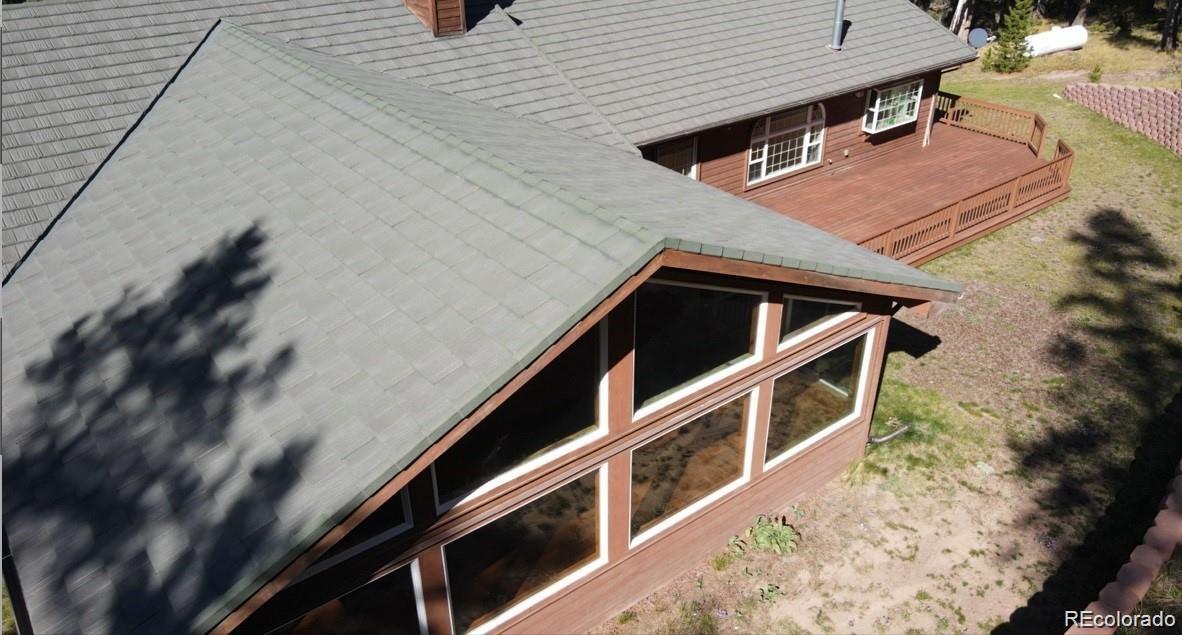 29469 County Road Fort Garland, CO 81133 - Photo 3 of 36 a balcony with wooden floor and fence