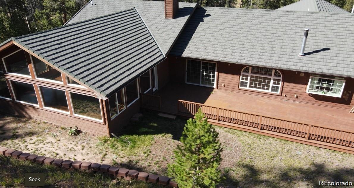 29469 County Road Fort Garland, CO 81133 - Photo 4 of 36 a front view of a house with a yard