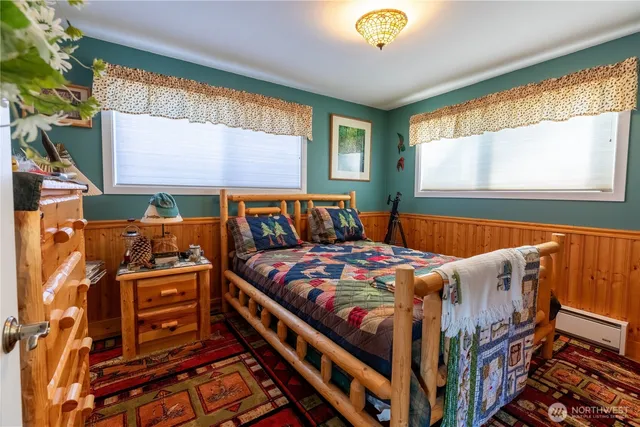 a bedroom with a bed and dresser