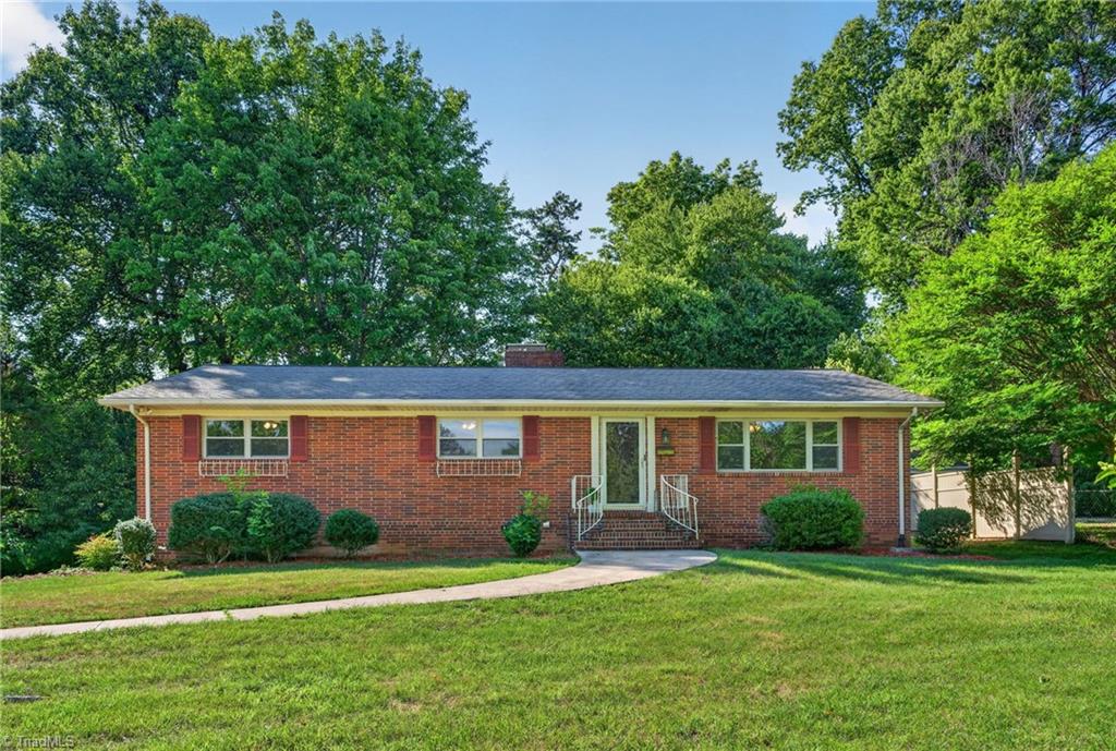 113 Green Valley Road Greensboro, NC 27403 - Photo 2 of 46 Set on nearly a half-acre beneath a canopy of mature trees, this home offers space, privacy, and the opportunity to enjoy one of Greensboro's most established neighborhoods.