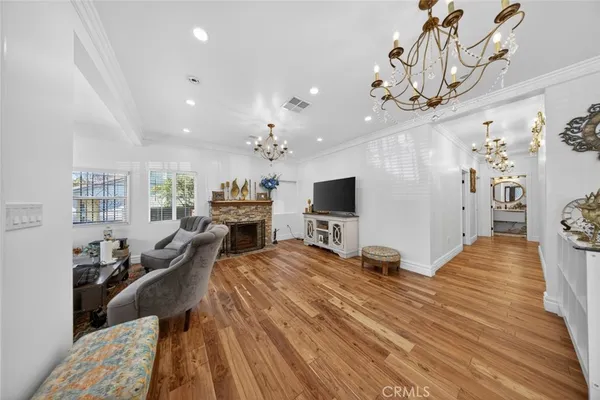 a bedroom with furniture and a flat screen tv