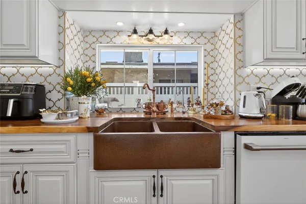a kitchen with a sink and cabinets