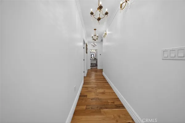 a hallway with a chandelier