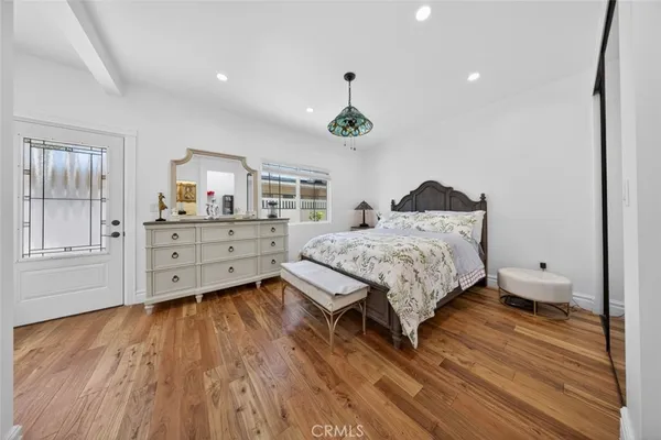 a bedroom with a bed and a dresser