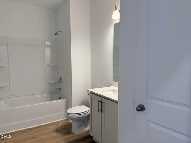 a bathroom with a toilet and a bathtub
