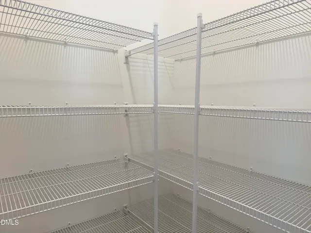 a view of a room with racks on the wall