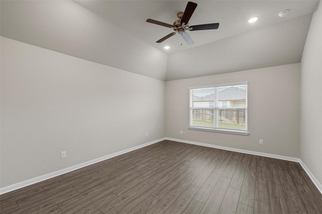 3208 Dottavio Road Lorena, TX 76655 - Photo 15 of 31 Room featuring vaulted ceilings, wood-finish flooring, recessed lighting, a ceiling fan, and a double-pane window with blinds