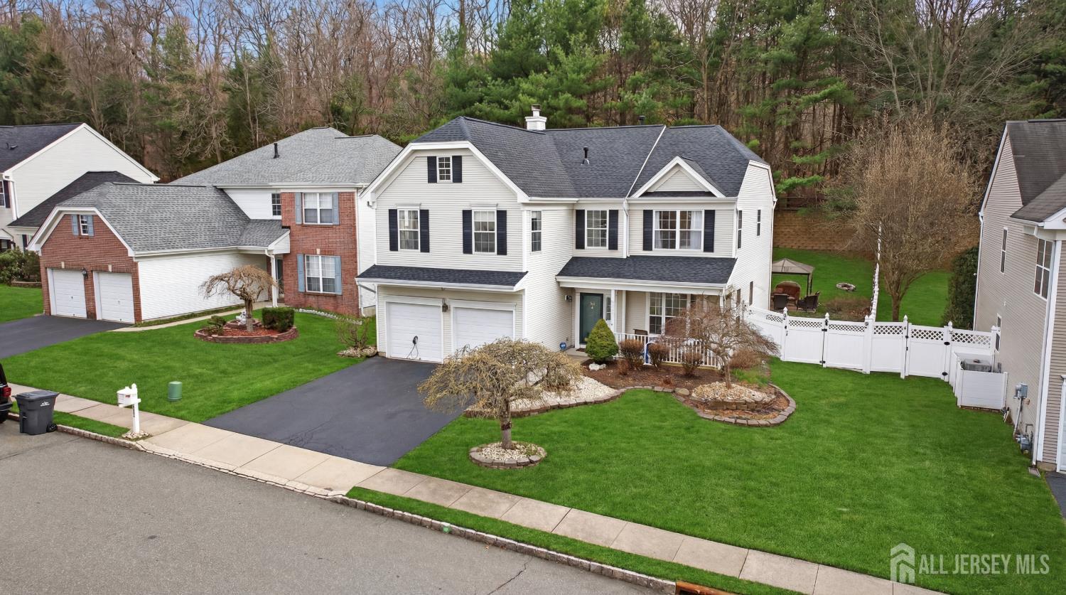 351 Wedgewood Road Morganville, NJ 07751 - Photo 11 of 74 a aerial view of a house with garden