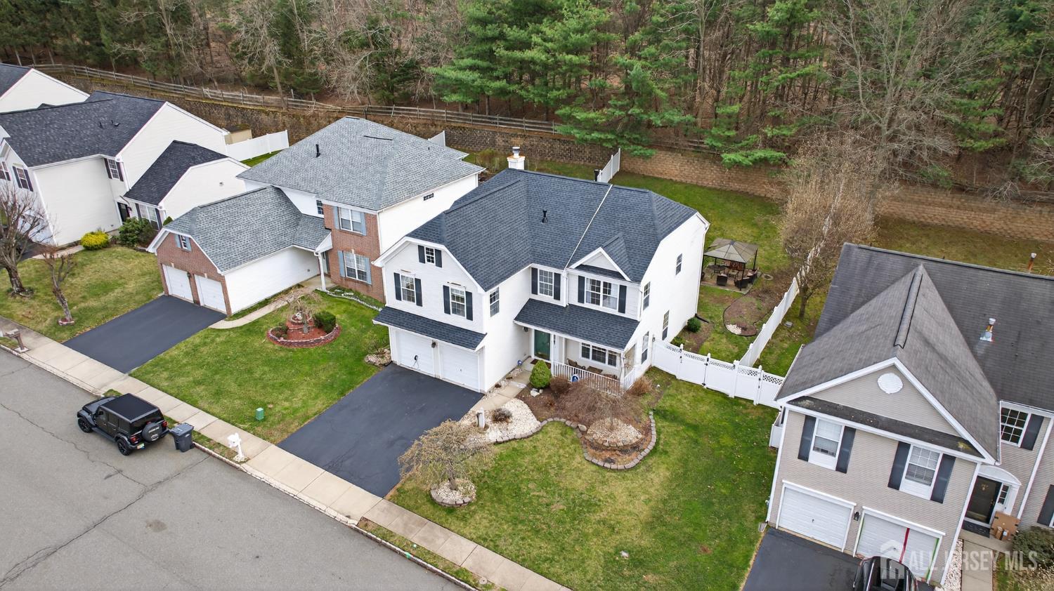 351 Wedgewood Road Morganville, NJ 07751 - Photo 17 of 74 an aerial view of a house with garden space and street view