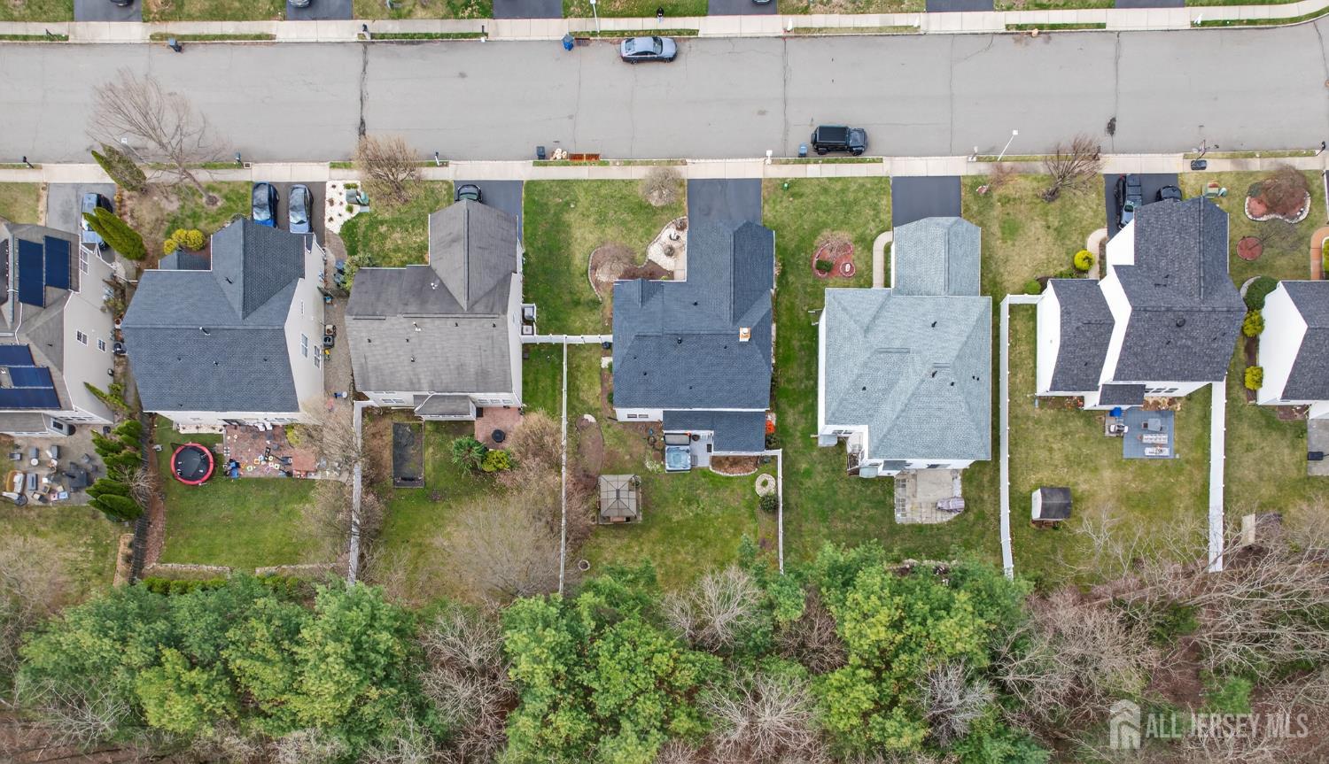 351 Wedgewood Road Morganville, NJ 07751 - Photo 20 of 74 an aerial view of residential house with outdoor space and swimming pool