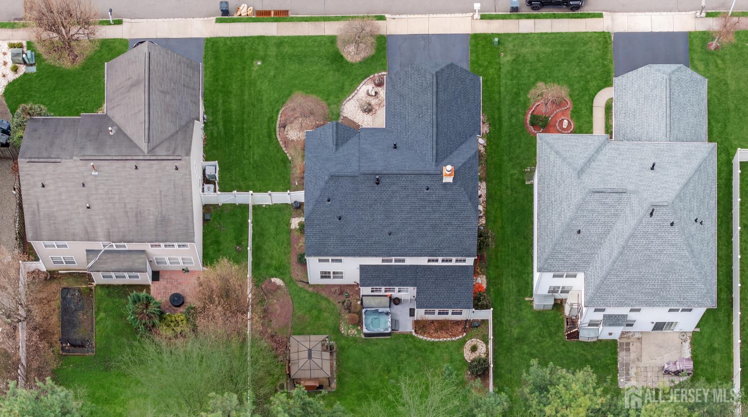 351 Wedgewood Road Morganville, NJ 07751 - Photo 2 of 74 an aerial view of multiple houses with outdoor space and parking